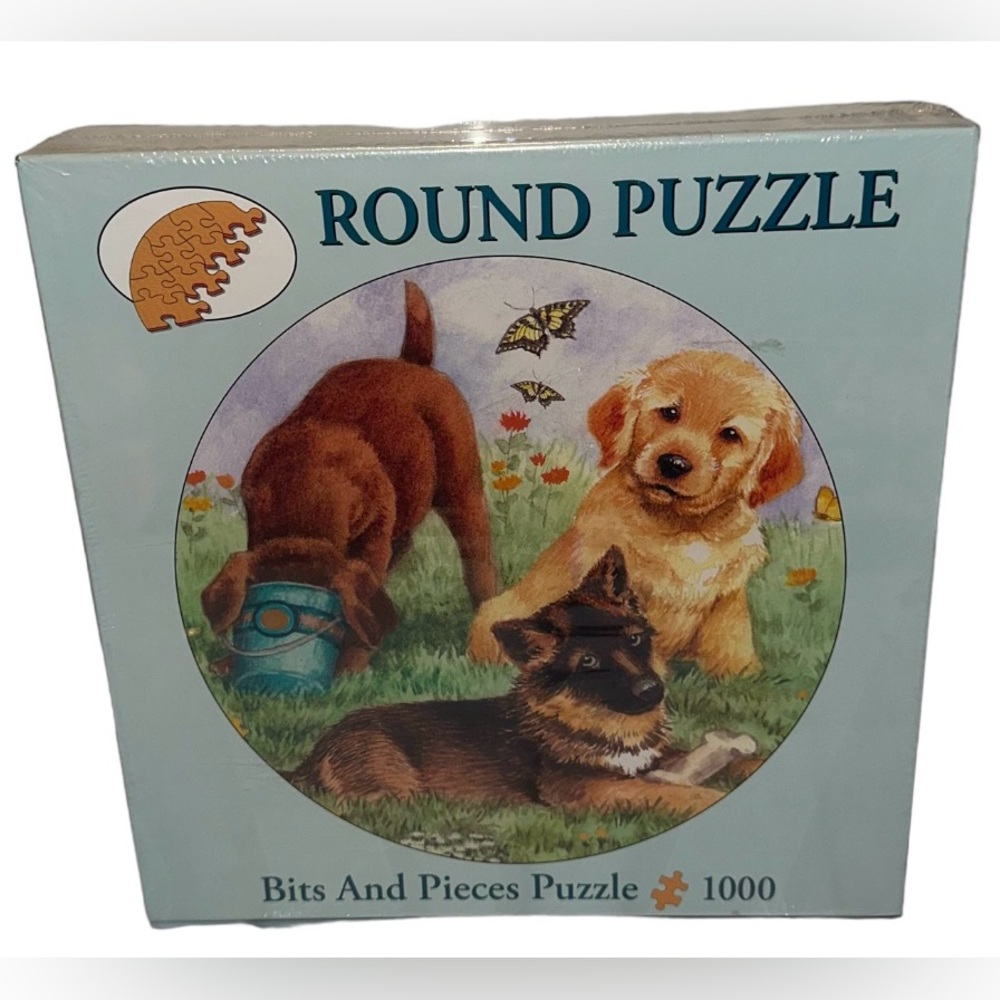 Bits and Pieces “” Round Jigsaw PLAYFUL PUPS IN A FIELD Puzzle 1000 piece